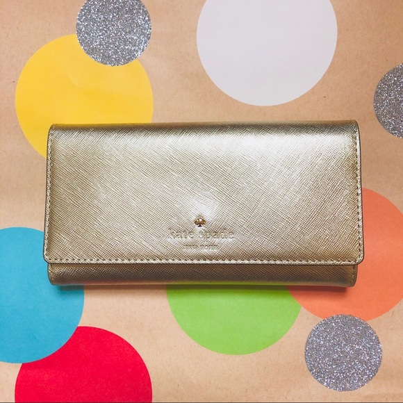 kate spade Handbags - NWT Kate Spade Cedar Street Gold Tri-fold Wallet
